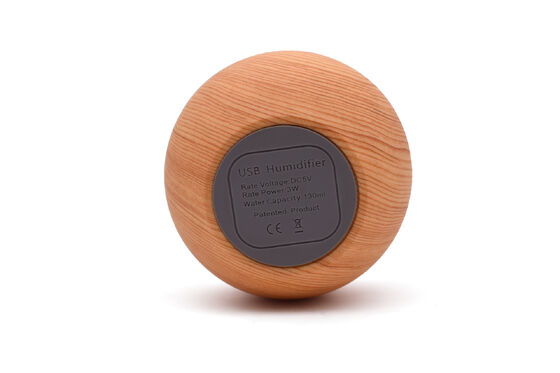 Difusor de diseño minimalista con acabado de grano de madera y base antideslizante